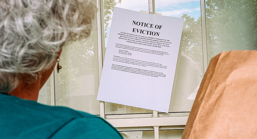 Person receiving an eviction notice which is taped to the door